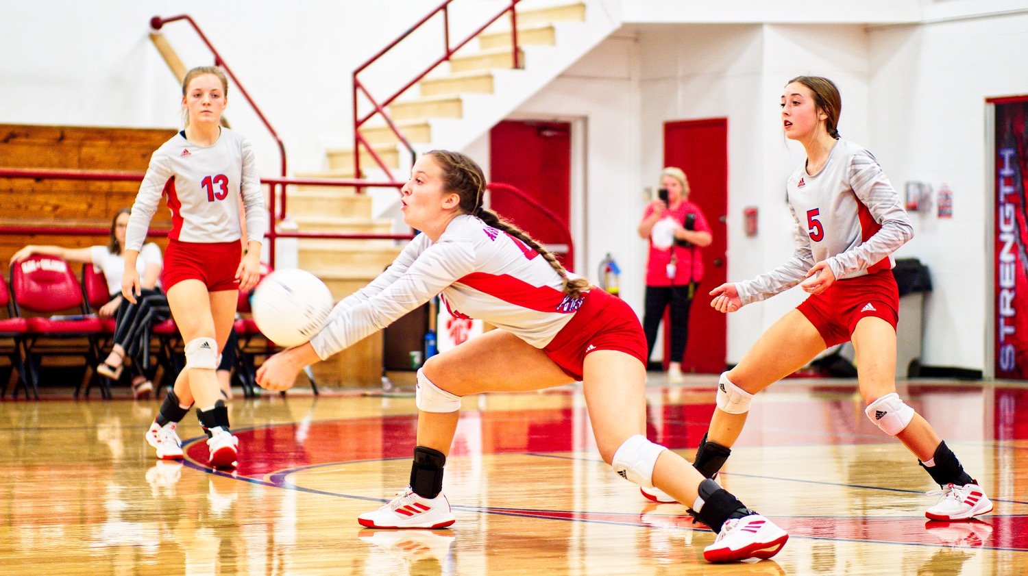 Skyler West gets low on defense as Cacie Lennon and Kamrin Wright await action at home Sept. 28 against Como-Pickton. [more from that match] West was named to second team all-district and earned academic all-district honors.